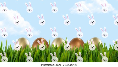 Image of easter bunnies over easter eggs in spring grass and blue sky. easter tradition and celebration concept digitally generated image.