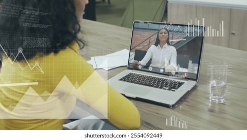 Image of financial data processing over diverse businesswomen on laptop image call. Global finance, business, connections, computing and data processing concept digitally generated image. - Powered by Shutterstock