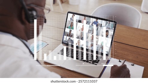 Image of financial data processing over african american man on laptop video call. Global finance, business, connections, computing and data processing concept digitally generated image.