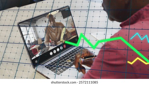Image of financial data processing over african american man on laptop video call. Global finance, business, connections, computing and data processing concept digitally generated image.