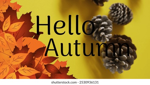 Image of hello autumn text over pine cones and autumn leaves on yellow background. Thanksgiving, american tradition and celebration concept digitally generated image. - Powered by Shutterstock