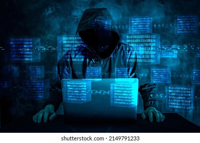 Image Of A Man In A Black Hoodie Pointing To The Screen Of A Laptop Computer At Home And Remotely Controlling It, Under A Blue Glowing Binary Data In A Glass Cube On Chains. 3D CG. 3D Illustration.