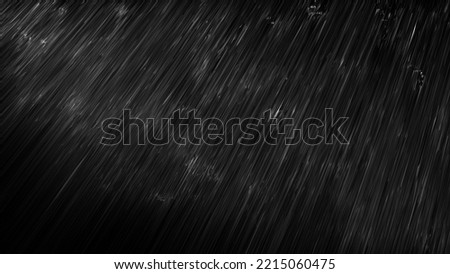 Image of rain falling on a black background