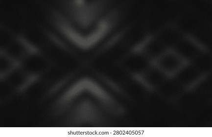 The image showcases an abstract visual of shadows creating a striking, symmetrical V-shape pattern on a dark, seemingly textured surface. The interplay of light and shadow forms an intriguing composition, emphasizing contrast and form. The overall effect is minimalist and evocative, with a focus on the interplay between light and darkness to create a visually engaging scene.