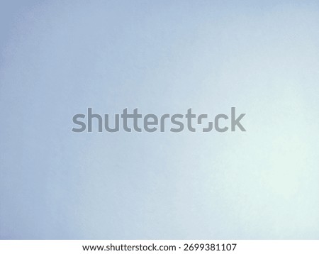 The image is a soft, blurred gradient background that transitions from a light blue on the left to a brighter, almost white color on the right. It resembles a clear sky on a sunny day 