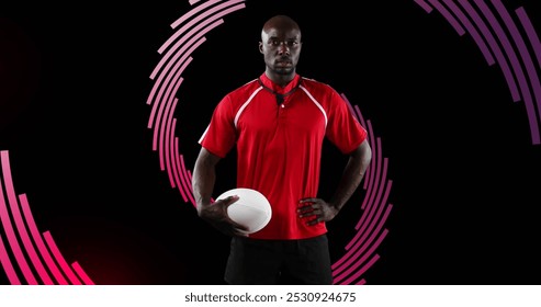 Image of spiral of red lines rotating over portrait of african american male rugby player. sport, achievement and communication technology concept, digitally generated image. - Powered by Shutterstock