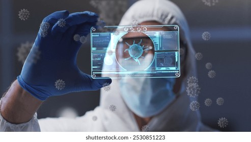 Image of virus cells and digital interface over male doctor wearing face mask. global medicine, healthcare and technology during covid 19 pandemic concept digitally generated image. - Powered by Shutterstock