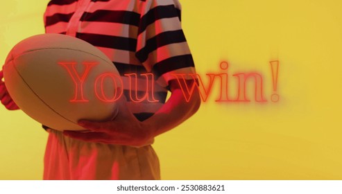 Image of you win text over female rugby player on neon background. Sports and communication concept digitally generated image. - Powered by Shutterstock