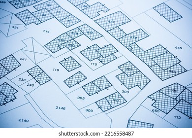 Imaginary Cadastral Map With Buildings, Land Parcel And Vacant Plot Printed On Paper
