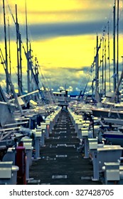 Impressionistic sunset abstract of dock and yachts at sailing center in Seattle, Washington, USA