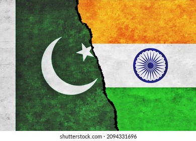 India and Pakistan painted flags on a wall with a crack. Pakistan and India relations. India and Pakistan flags together. India vs Pakistan