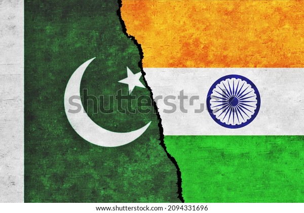 India and Pakistan painted flags on a wall with\
a crack. Pakistan and India relations. India and Pakistan flags\
together. India vs\
Pakistan
