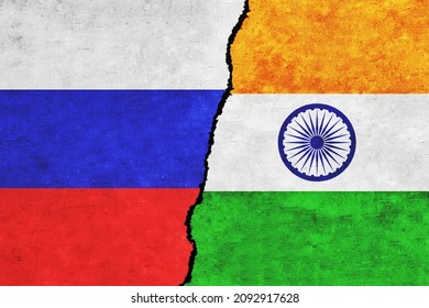 India and Russia painted flags on a wall with a crack. India and Russia conflict. Russia and India flags together. India vs Russia