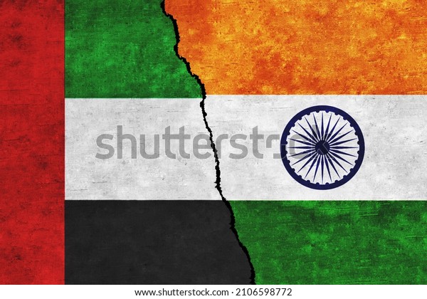 India and UAE painted flags on a wall\
with a crack. India and United Arab Emirates\
relations