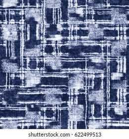 Indigo dyed abstract graphic motif textured background. Seamless pattern.