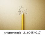 Individuality, creative idea and uniqueness concept with yellow pencil veiled under a burning light bulb on kraft paper background. 3D rendering