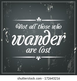 Inspirational quote on a black chalk board "Not all those who wander are lost"