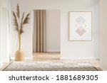 Interior of a beige hall with a vertical poster, pampas grass in a wicker vase between doorways, a carpet on a parquet floor, overlooking a room with a window. 3d render