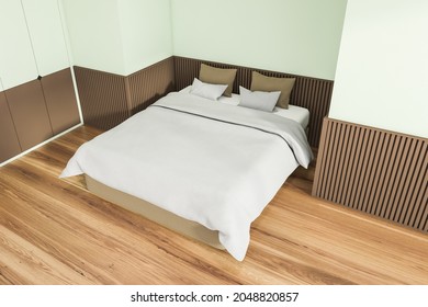 Interior Design Of Trendy Bedroom In Soft Shade Of Green. Wood Floor, Basement Ledge And Comfortable Bed. Top View. A Concept Of A Modern Apartment. 3d Rendering