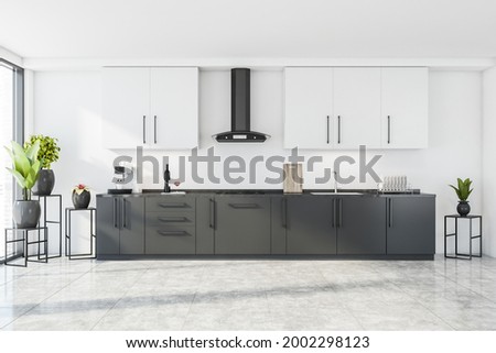 Interior design with white and grey modular kitchen cabinet, white wall and ceiling. Flower stands at the panoramic window and in corner. Tiling floor. 3d rendreing