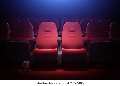 Interior of empty cinema with rows of red seats with cup holders and popcorn. Concept of entertainment. 3d rendering toned image