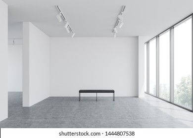 Interior of empty gallery with white walls, concrete floor, large window, bench and ceiling lamps. Concept of advertising and marketing. 3d rendering, mock up