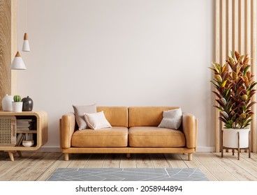 Interior living room wall mockup with leather sofa and decor on white background.3d rendering