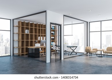 Interior Of Manager Office With White And Glass Walls, Concrete Floor, Computer Desk, Small Meeting Table And Wooden Bookcase With Folders. Lounge Area With Armchair. 3d Rendering