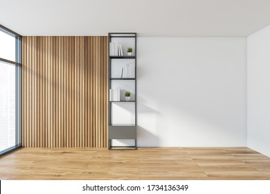 Interior Of Minimalistic Home Library With White And Wooden Walls, Wooden Floor And Metal Bookcase With Books And Plants. 3d Rendering