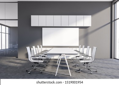 Interior Of Modern Conference Room With Gray Walls, Long White Meeting Table With Chairs And Horizontal Mock Up Poster. White Cabinets. 3d Rendering