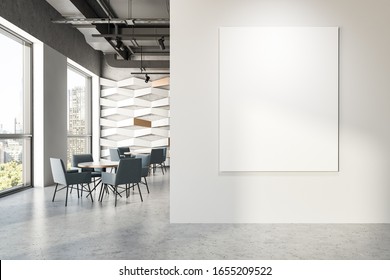 Interior of modern industrial style restaurant with white and geometric pattern walls, grey ceiling, concrete floor and round tables with grey armchairs. Mock up poster to the right. 3d rendering