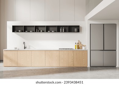 Interior of modern kitchen with white walls, concrete floor, comfortable wooden cabinets with built in cooker and sink and big refrigerator. 3d rendering