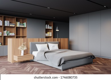 Interior Of Modern Master Bedroom With Gray Walls, Dark Wooden Floor, Comfortable King Size Bed And Bookcase. 3d Rendering