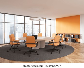 Interior of modern meeting room with white and orange walls, wooden floor, round conference table with orange chairs and cabinet with folders. 3d rendering - Powered by Shutterstock