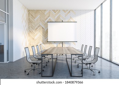 Interior Of Modern Office Meeting Room With White And Wooden Walls, Concrete Floor And Long Conference Table. Mock Up Presentation Screen. 3d Rendering