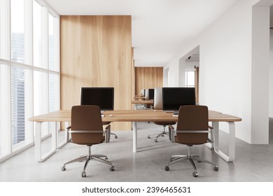 Interior of modern open space office with white and wooden walls, concrete floor and long computer table with brown chairs. 3d rendering
