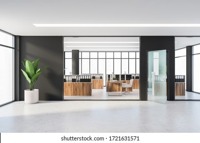 Interior Of Modern Panoramic Office With Black Walls, Tiled Floor, Dark Wooden Cubicles With Computer Tables And File Cabinets. Windows With Blurry Cityscape. 3d Rendering