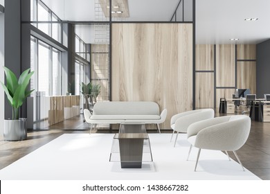 Interior of office waiting room with gray and wooden walls, comfortable armchairs and sofa near coffee tables and open space area in background. 3d rendering