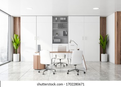 Interior Of Panoramic CEO Office With White And Wooden Walls, Tiled Floor, Computer Table With Chairs For Visitors And Bookcases With Folders. Blurry Cityscape. Concept Of Management. 3d Rendering