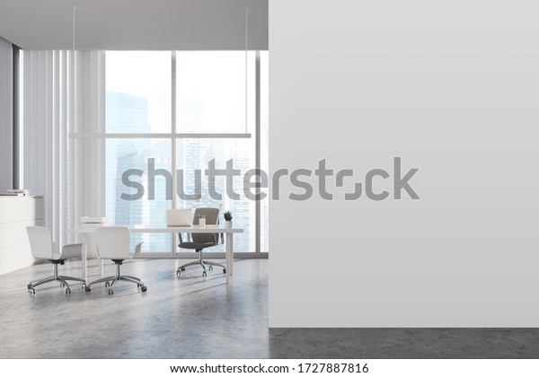 Interior of panoramic CEO office with white\
walls, concrete floor, white computer table with chairs for\
visitors and window with blurry cityscape. Mock up wall to the\
left. 3d\
rendering