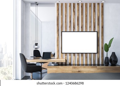 Interior Of Small Home Office With White And Wooden Walls, Black Floor, Wooden Computer Table And Armchair And Mock Up Tv Set Screen On The Wall. 3d Rendering