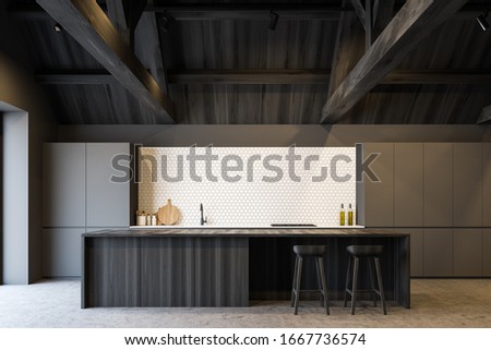 Interior of spacious attic kitchen with gray and white tile walls, concrete floor, grey countertops with built in appliances and dark wooden bar with stools. 3d rendering