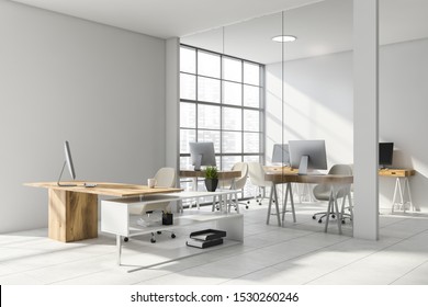 Interior of stylish CEO office with white and glass walls, tiled floor, comfortable desk and open space area with compact computer tables in background. 3d rendering