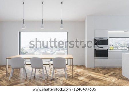 Interior of stylish kitchen with white walls, wooden floor, big window, white countertops and two ovens and wooden table with white chairs. 3d rendering