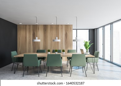 Interior Of Stylish Office Conference Room With Grey And Wooden Walls, Long Meeting Table With Green Armchairs And Industrial Style Lamps Hanging Above It. 3d Rendering