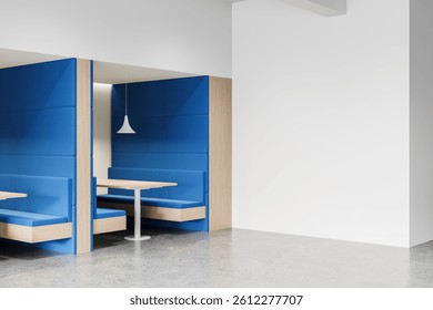 Interior view of modern booth seating with blue cushioned panels, pendant light, and blank white wall background. Clean layout mockup display concept. 3D Rendering