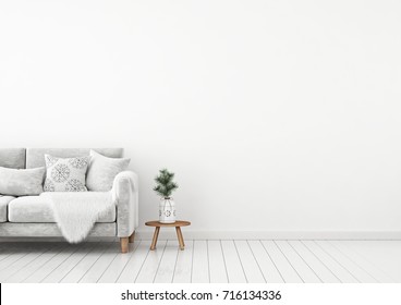 Interior wall mock up with velvet sofa, pillows, plaid and pine branch in vase on empty white background. 3D rendering. 