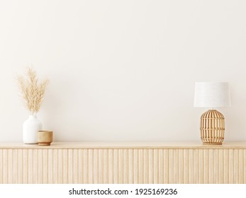 Interior wall mockup in minimalist Japandi style with light biege wooden console, dried pampas grass and wicker basket lamp on empty warm white background. Close up view, 3d rendering, 3d illustration
