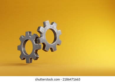 Interlocking gears isolated on yellow background. 3D illustration of company teamwork and business cooperation