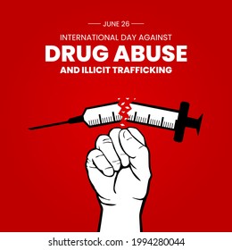 International Day against Drug Abuse and Illicit Trafficking. Observed on 26th JUNE. A hand trying to break a drug syringe.